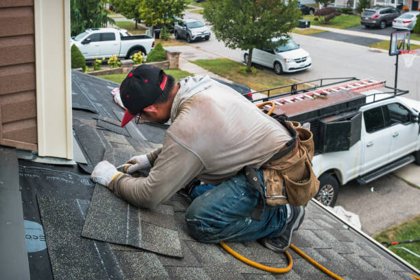 Professional Roof Replacement technician working in Coram, MT